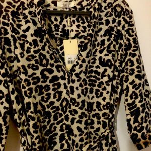 Dress above the knee with waisted belt